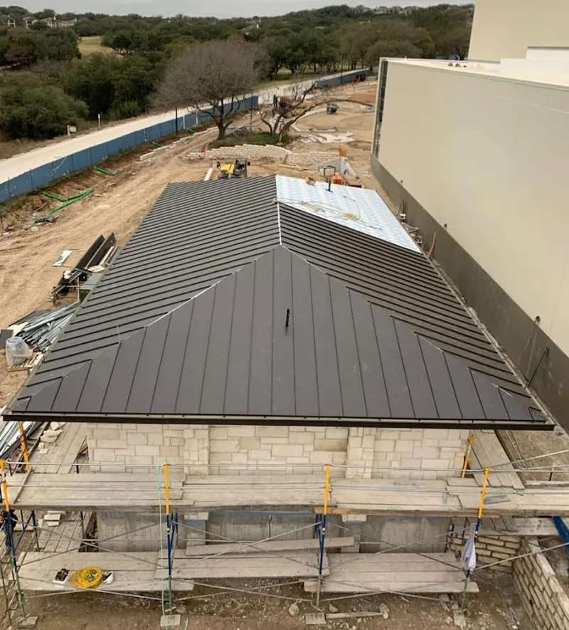 Metal roof new construction with scaffolding in Alabaster
