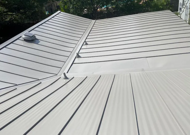 Solar attic fan installed on a metal roof for Roof Ventilation in Alabaster